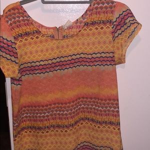 Orange patterned top. Size M. Worn once.